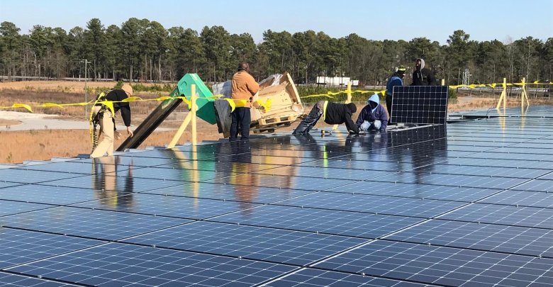 Solar Installers Completing Commercial Photovoltaic Installation