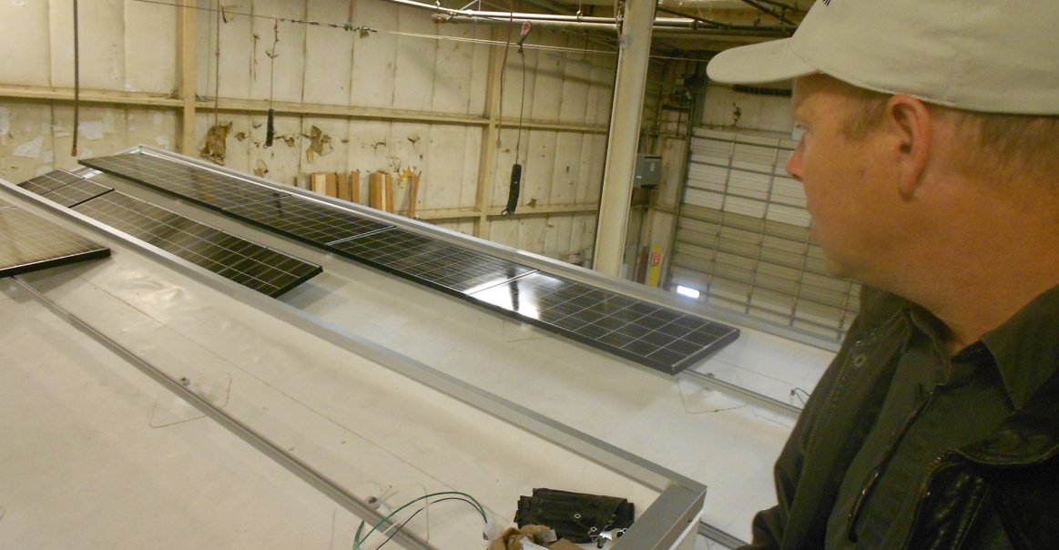 Solar panels get installed at the factory for a commercial project. Solar panels get installed at the factory for a commercial project.