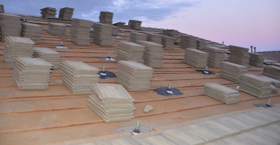 Quick Mount PV Tile Mounts Quick Mount installation on rooftop of residential installation project.