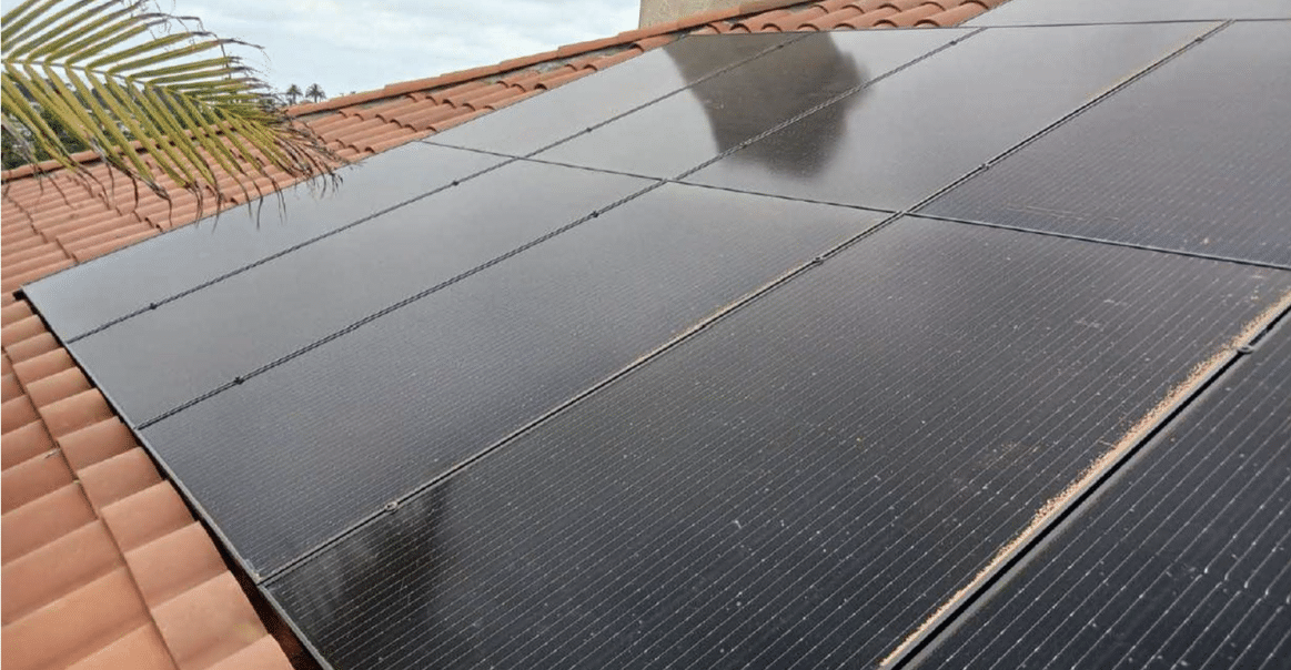 Close up of solar panels on residential rooftop. 