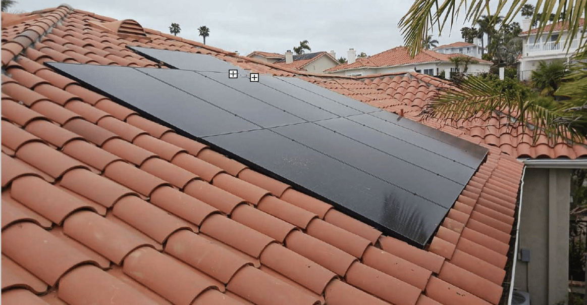 Left side view of solar panel system on rooftop.