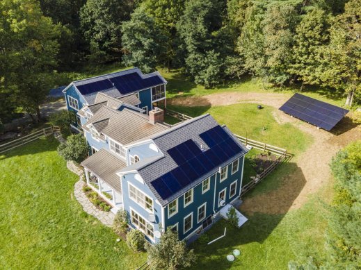 Residential roof mount and ground mount solar panel system in Vermont.