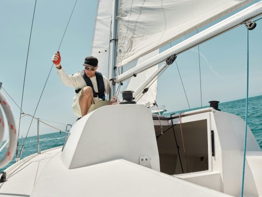 Homeowner on boat doing electrical grounding maintenance. 